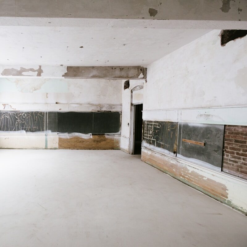 Detail of sheeted walls in a room prepared for work