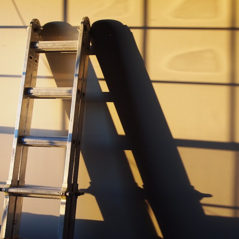 Detail of a ladder against a finished wall
