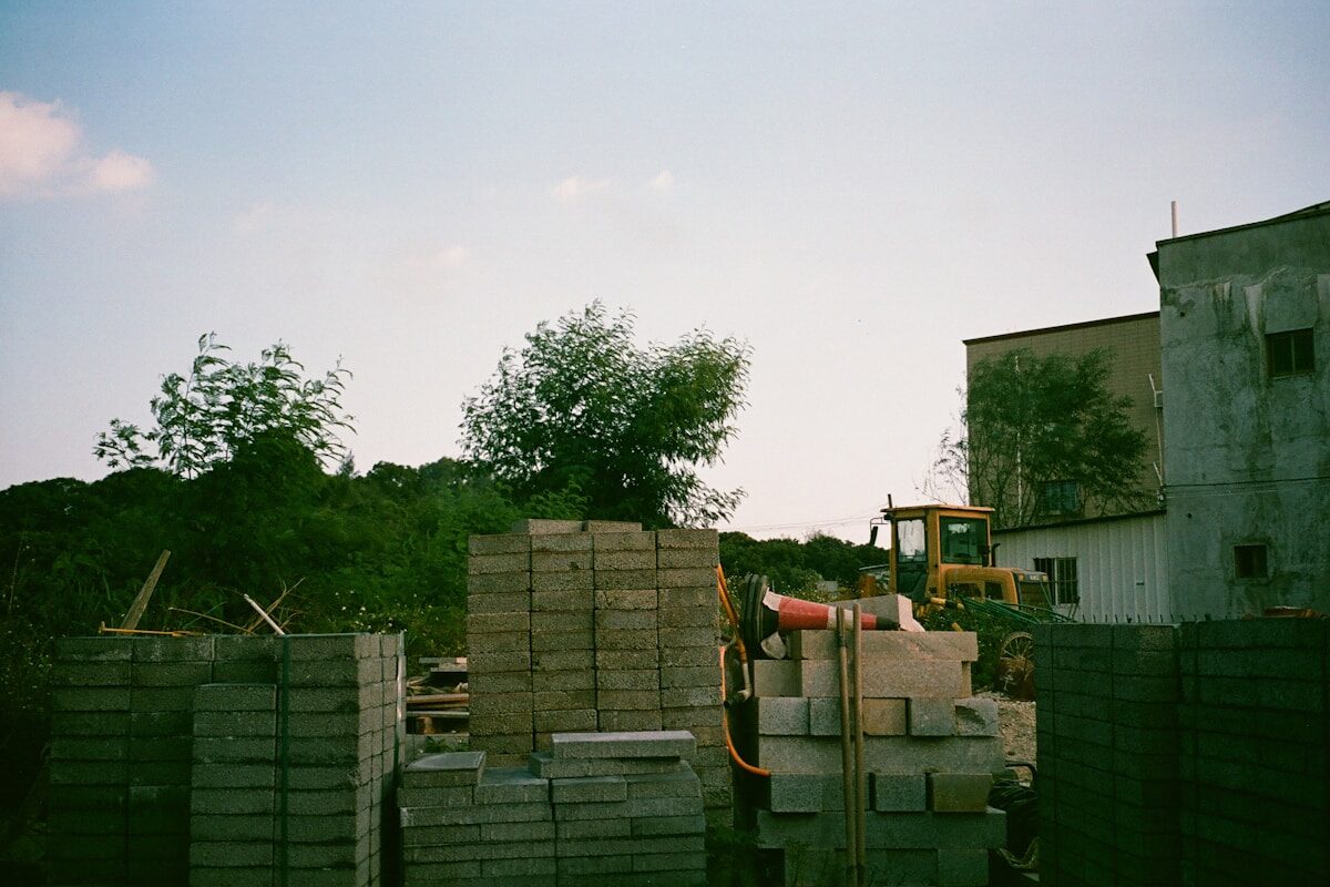 Stacked bricks and masonry materials on a building site